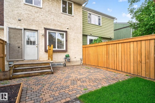 Rear exterior featuring a paver patio and private wooden fencing - 8059 178 Street Nw, Edmonton, AB - Outdoor With Exterior