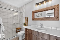 3 Piece Primary Bathroom featuring Glass Shower, Vanity with Storage, and Subway Tile. - 