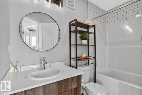 4 Piece 3rd Floor Bathroom featuring Tub/Shower, Vanity with Storage, and Subway Tiling. - 1051 Cy Becker Road Nw, Edmonton, AB - Indoor Photo Showing Bathroom