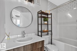 4 Piece 3rd Floor Bathroom featuring Tub/Shower, Vanity with Storage, and Subway Tiling. - 