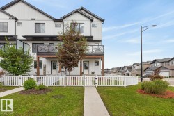 Front of Home located on a Landscaped Corner Lot. Fully Fenced with Front and Side Entrance. - 