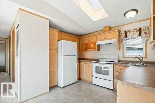 #1254 53222 Range Road 272, Rural Parkland County, AB - Indoor Photo Showing Kitchen With Double Sink