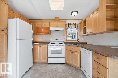 #1254 53222 Range Road 272, Rural Parkland County, AB - Indoor Photo Showing Kitchen With Double Sink