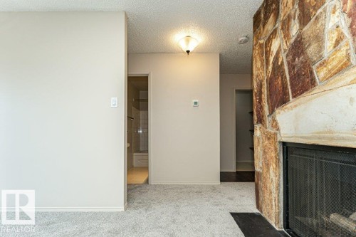 #310 14004 26 St Nw, Edmonton, AB - Indoor Photo Showing Other Room With Fireplace