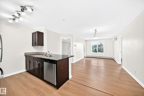 #206 3315 James Mowatt Tr Sw, Edmonton, AB - Indoor Photo Showing Kitchen With Double Sink