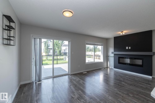 5233 Crabapple Link Sw, Edmonton, AB - Indoor Photo Showing Living Room With Fireplace