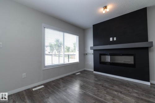5233 Crabapple Link Sw, Edmonton, AB - Indoor Photo Showing Living Room With Fireplace