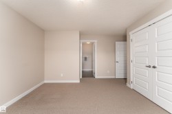 Neutral-toned carpeting paired with light-colored walls - 