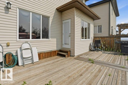 Expansive wood-finish deck offering direct access to the interior - 258 Albany Drive Nw, Edmonton, AB - Outdoor With Deck Patio Veranda With Exterior