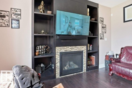 Living room - 258 Albany Drive Nw, Edmonton, AB - Indoor Photo Showing Living Room With Fireplace