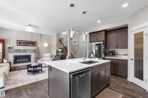 11 Rolston Close, Leduc, AB - Indoor Photo Showing Kitchen With Fireplace With Double Sink With Upgraded Kitchen