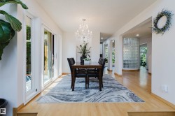 Light wood-finish flooring extending through the space - 