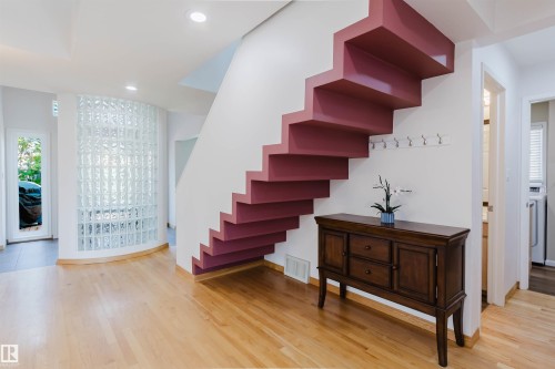 Floating staircase featuring a contemporary design, light wood-finish flooring, and recessed ceiling lighting - 342 O'Connor Close Nw, Edmonton, AB - Indoor Photo Showing Other Room