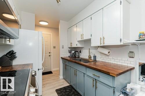10B Callingwood Court Nw, Edmonton, AB - Indoor Photo Showing Kitchen With Double Sink