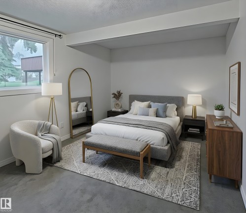 Bright bedroom with light gray walls, a window featuring a black curtain rod, and a textured ceiling - 60 Northwoods Village Nw, Edmonton, AB - Indoor Photo Showing Bedroom