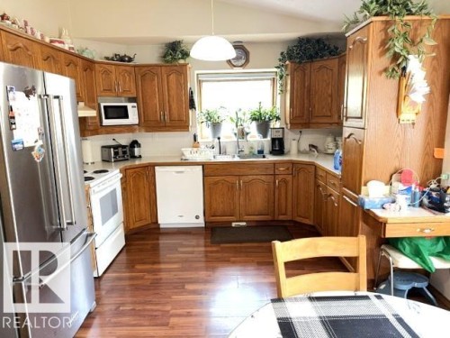 oak cupboards, lots of counter space, fridge (4.5 years) - 212 West Liberty Crescent, Millet, AB - Indoor Photo Showing Kitchen