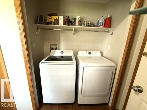 laundry located right off of garage entrance - 212 West Liberty Crescent, Millet, AB - Indoor Photo Showing Laundry Room