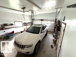 there is actually room for two vehicles in this garage. Inside measurements are 19x23 - 
