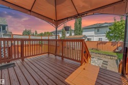 Spacious wooden deck with a privacy lattice and a gazebo canopy - 