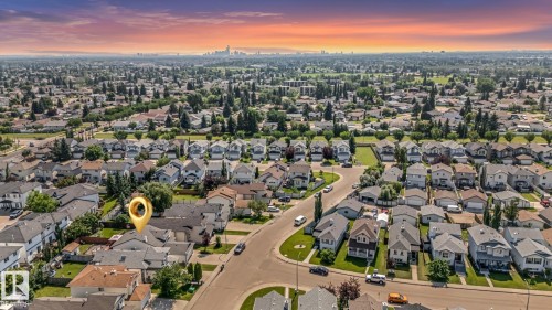 Residential neighborhood setting featuring single-family homes and mature landscaping - 16737 116 Street Nw, Edmonton, AB 