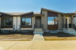 Modern multi-family dwelling featuring a contemporary façade with contrasting vertical and horizontal siding panels - 