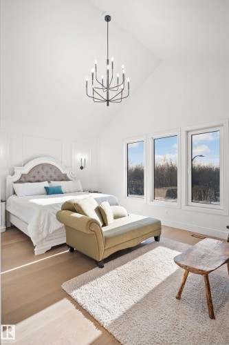 Vaulted ceiling featuring a contemporary chandelier - 12304 62 Ave Nw, Edmonton, AB - Indoor Photo Showing Bedroom