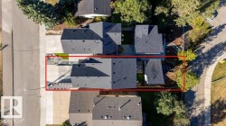Aerial perspective showcasing a property with a gray shingled roof - 