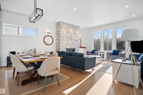 Open-concept living area with wood-finish flooring - 12304 62 Ave Nw, Edmonton, AB - Indoor