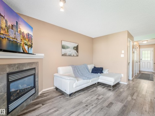 3635 11 Street Nw, Edmonton, AB - Indoor Photo Showing Living Room With Fireplace
