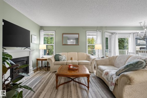 76 Leyland Way, Spruce Grove, AB - Indoor Photo Showing Living Room With Fireplace