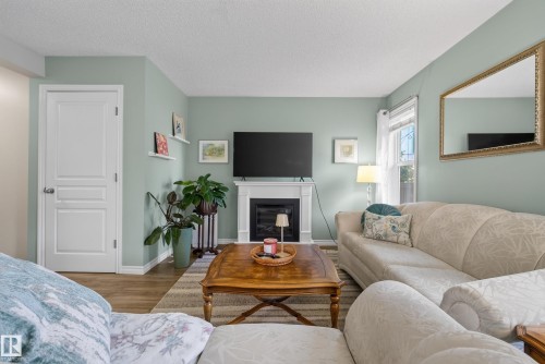 76 Leyland Way, Spruce Grove, AB - Indoor Photo Showing Living Room With Fireplace