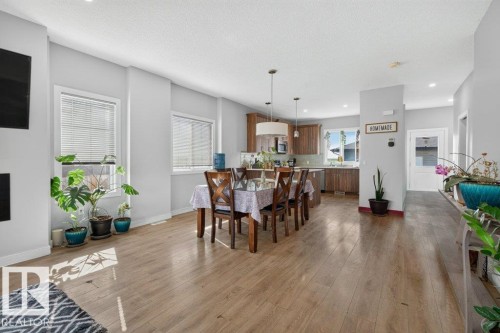 Expansive open concept living area featuring wood-finish flooring throughout - 43 Sienna Boulevard, Fort Saskatchewan, AB - Indoor