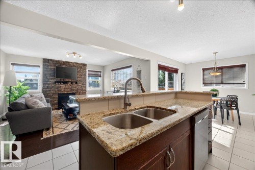 18069 89 Street Nw, Edmonton, AB - Indoor Photo Showing Kitchen With Fireplace With Double Sink