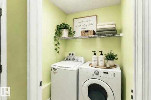 Virtually staged - Dedicated laundry area featuring a wire shelving unit - 13148 151 Avenue Nw, Edmonton, AB - Indoor Photo Showing Laundry Room