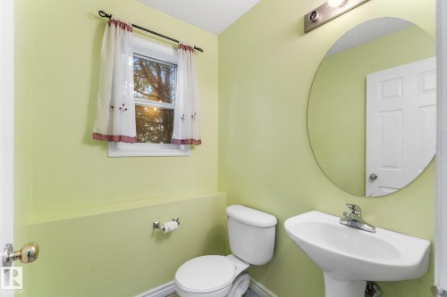 2 piece bathroom found on main, lower level, beside the laundry room. - 13148 151 Avenue Nw, Edmonton, AB - Indoor Photo Showing Bathroom