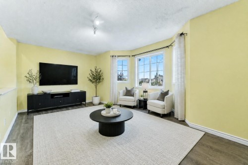 Virtually staged - Upper Floor bonus room - 13148 151 Avenue Nw, Edmonton, AB - Indoor Photo Showing Living Room
