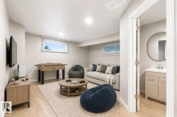Virtually staged basement rec room with 3 piece bathroom - 