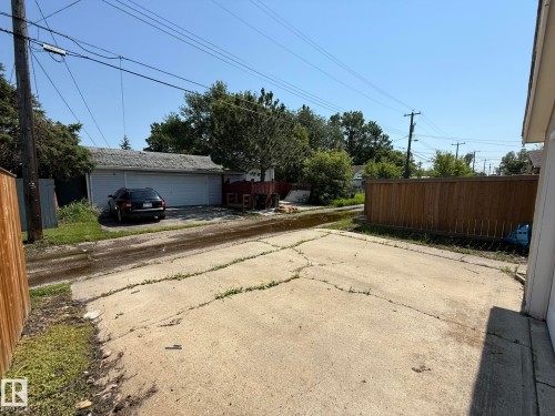 Detached garage with two white garage doors and a shingled roof - 10837 155 Street Nw, Edmonton, AB - Outdoor