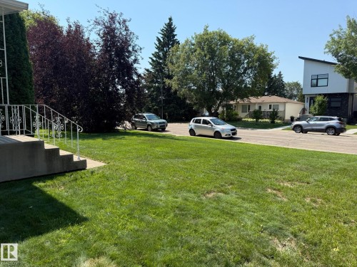 Grassy front yard with mature trees - 10837 155 Street Nw, Edmonton, AB - Outdoor