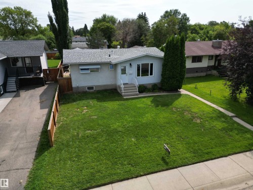 Light-colored single-story residence with a gray shingle roof and white trim - 10837 155 Street Nw, Edmonton, AB - Outdoor