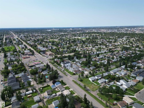 Expansive aerial view showcasing a residential neighborhood with mature tree-lined streets and a mix of single-story and multi-story homes - 10837 155 Street Nw, Edmonton, AB - Outdoor With View