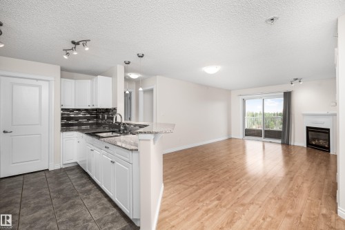#408A 6 Spruce Ridge Dr, Spruce Grove, AB - Indoor Photo Showing Kitchen With Fireplace