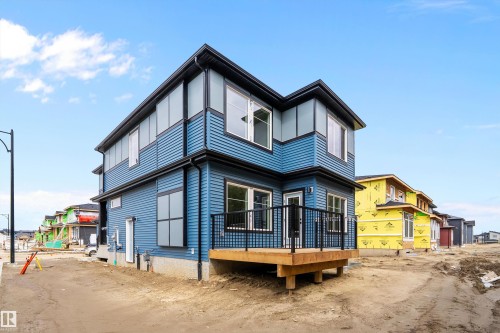 Contemporary two-story exterior with blue horizontal siding - 1737 Crossbill Loop Nw, Edmonton, AB - Outdoor