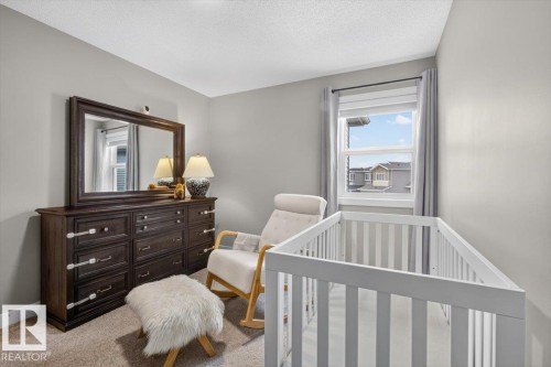 Light gray painted walls with white trim - 347 Bluff Cove, Leduc, AB - Indoor Photo Showing Bedroom