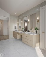 Bathroom featuring a dual vanity with light wood-finish cabinetry, white countertops, and gold-tone fixtures - 