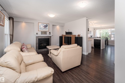 2338 Glenridding Boulevard Sw, Edmonton, AB - Indoor Photo Showing Living Room With Fireplace