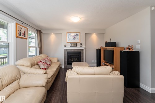 2338 Glenridding Boulevard Sw, Edmonton, AB - Indoor Photo Showing Living Room With Fireplace