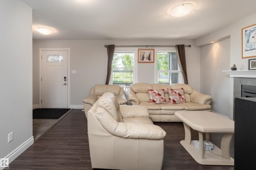 2338 Glenridding Boulevard Sw, Edmonton, AB - Indoor Photo Showing Living Room With Fireplace