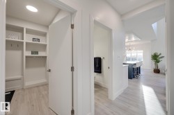 Entryway featuring wood-finish flooring extending into the main living spaces - 