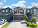 Two-story residence featuring a two-car attached garage with a concrete driveway - 4620 Alwood Way Sw, Edmonton, AB  - Outdoor With Facade 